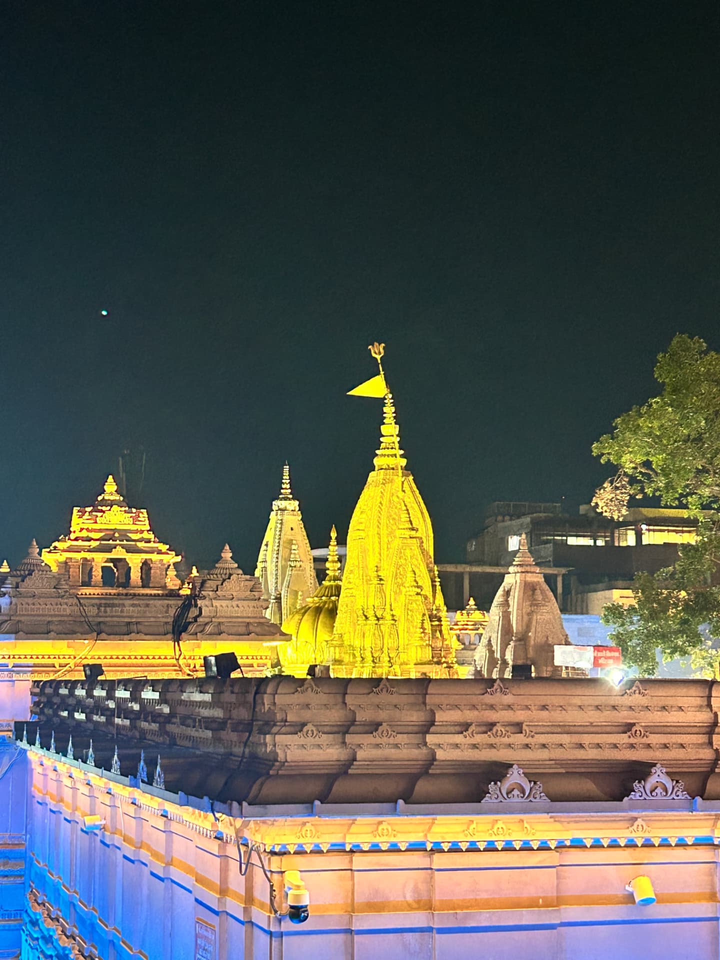 Kashi Vishwanath temple spires lit up at night
